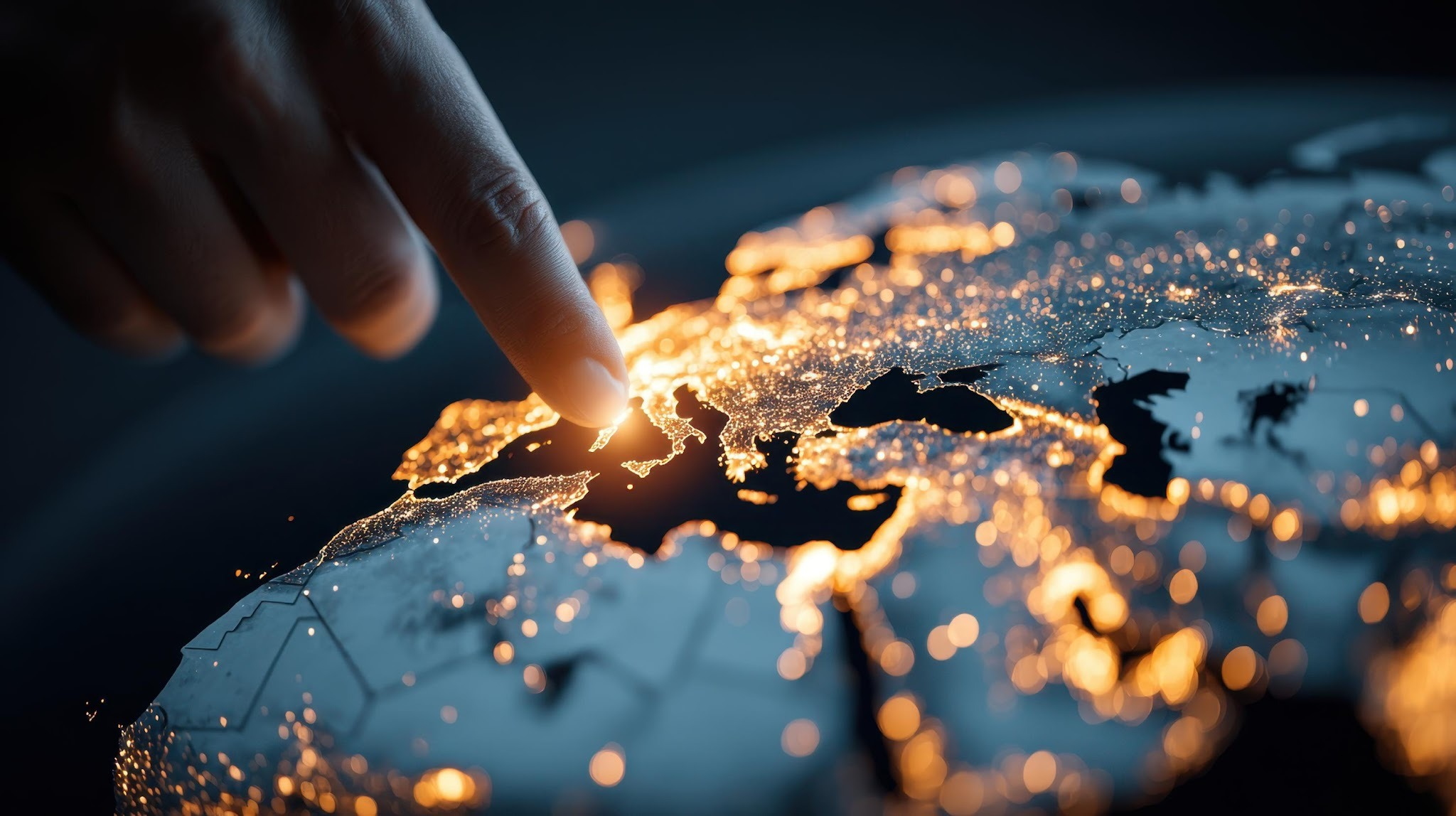 Hand pointing at a glowing digital world map representing global scalable engagement